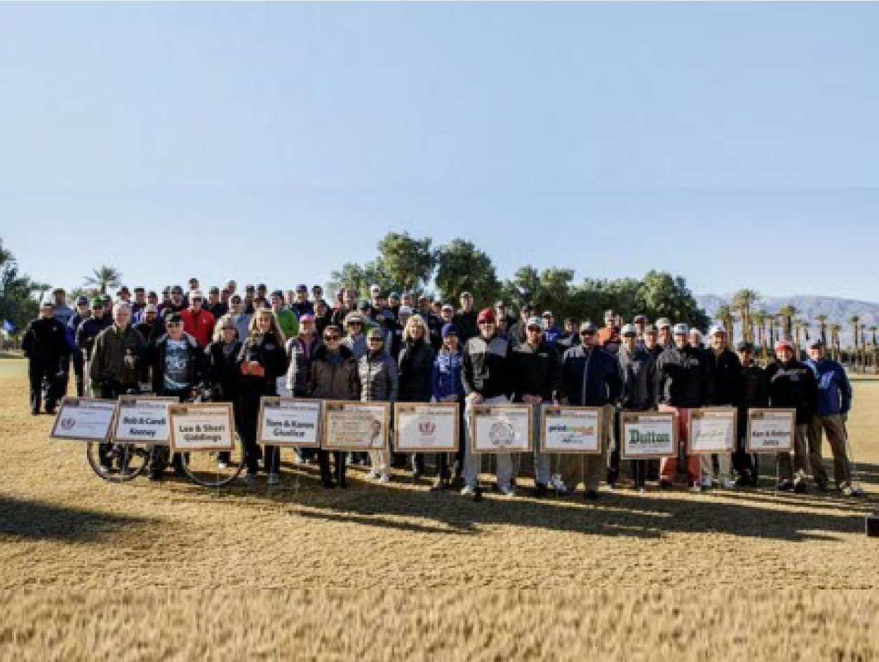 Group of people standing with a board in their hands